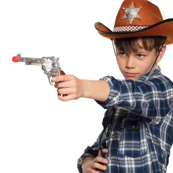 Young child holding cowboy pistol